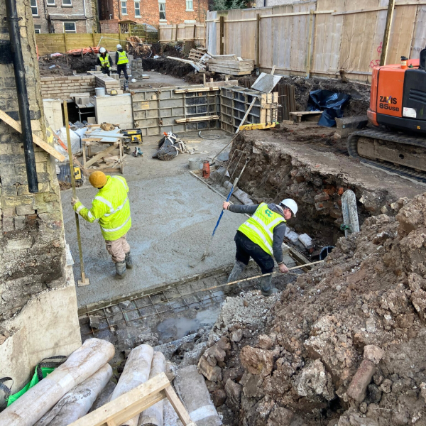 Hartington Road Liverpool foundation work with construction team laying concrete base