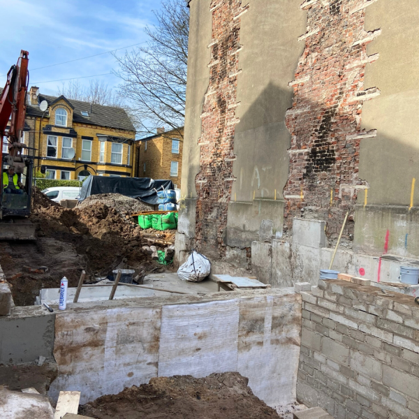 Hartington Road Liverpool foundation work with construction team laying concrete base