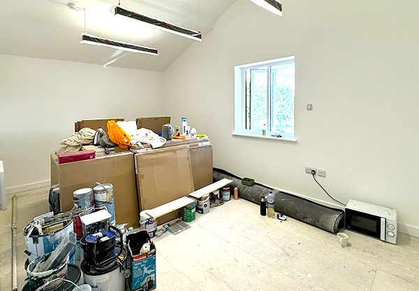 New Start Homes Liverpool office room nearing completion showing painted walls and electrical installations