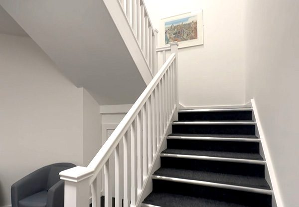 New Start Homes Liverpool office completed staircase installation showing white painted balustrade and carpet