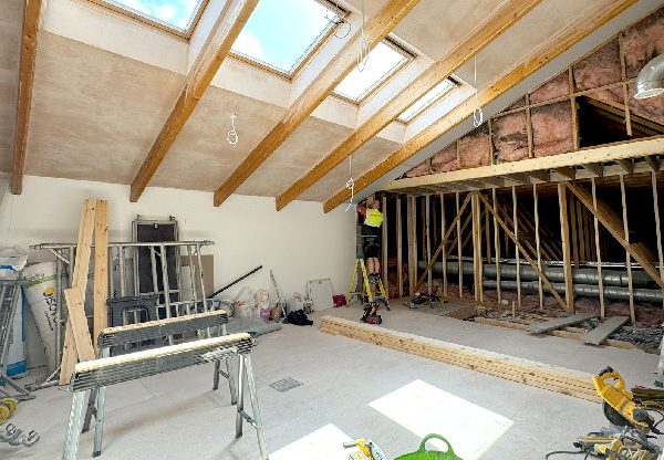 New Start Homes office Liverpool upper floor boardroom construction showing new skylights and insulation installation